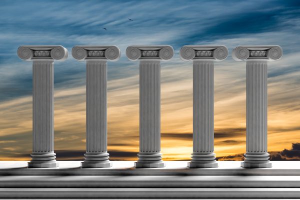 Five ancient pillars with sunset sky background.